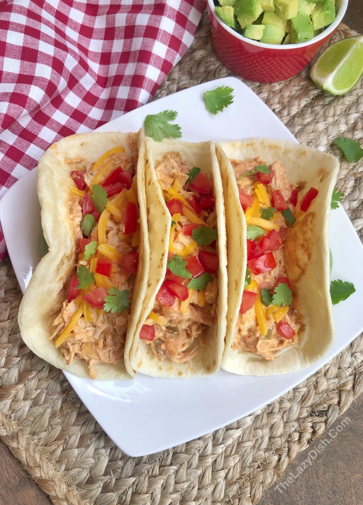 Easy Crockpot Chicken Recipe - Creamy Chicken Tacos made with 3 ingredients: chicken, salsa and cream cheese!