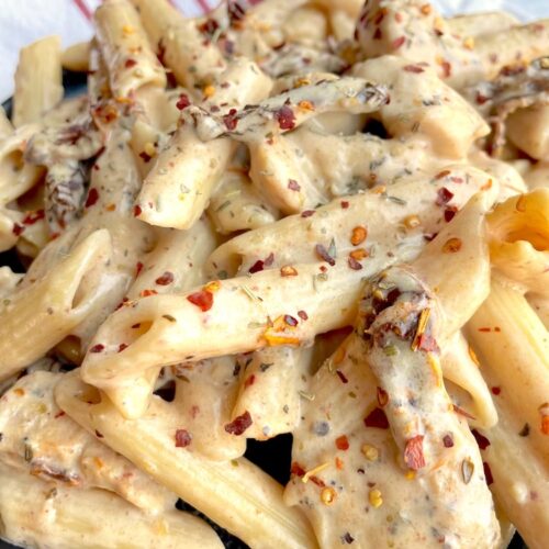 The best cream sun dried tomato pasta recipe! Easy to make with homemade creamy sauce and sautéed chicken.