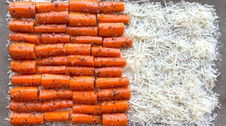 The best way to roast carrots in the oven with a sheet pan of shredded parmesan cheese!