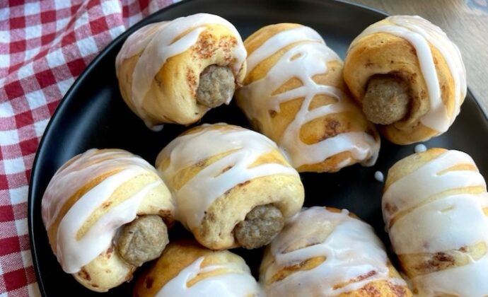 This fun and yummy breakfast is easy to make with just 2 ingredients! Pillsbury Cinnamon Rolls and frozen sausage links. Quick to bake for special occasion, birthdays, first day of school, sleepovers, and holidays.
