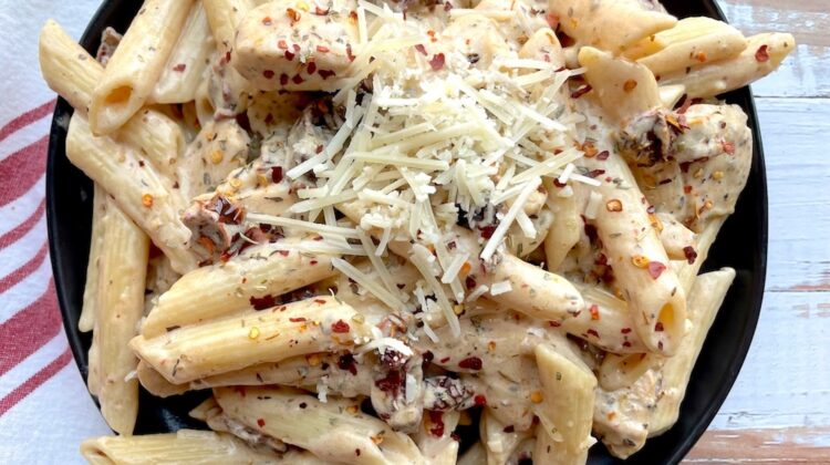 Easy creamy sun dried tomato pasta with chicken and garlic! A delicious family dinner recipe that you'll want to make over and over again.