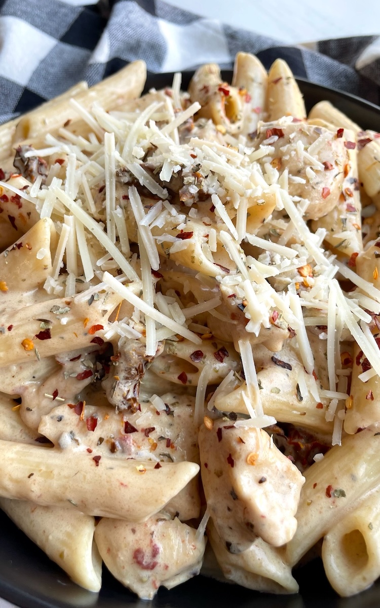 Easy chicken dinner recipe for your picky family! My kids love this simple penne and chicken recipe. It has a heavenly cream sauce with sun dried tomatoes and garlic that is seriously to die for. 