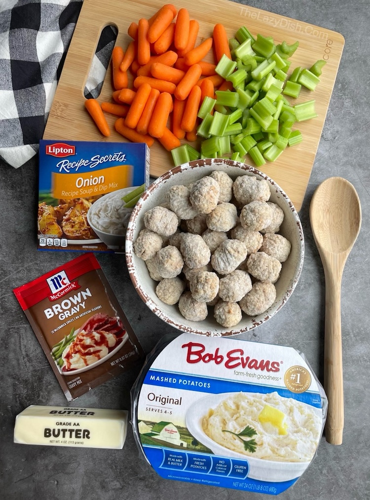 List of ingredients needed to make an easy meatball pot roast: frozen meatballs, carrots, celery, onion soup mix, brown gravy mix, butter, and mashed potatoes. 