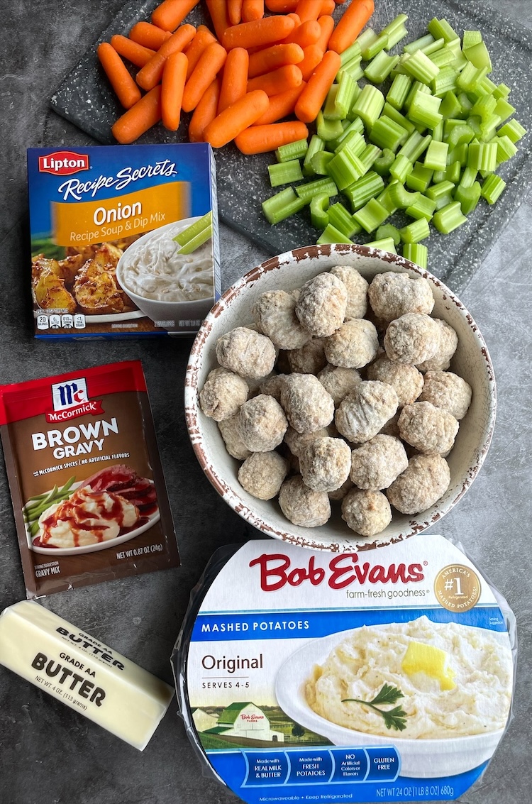 How to make a slow cooker pot roast with just a few basic ingredients: frozen meatballs, carrots, celery, onion soup mix, brown gravy mix, and butter. 
