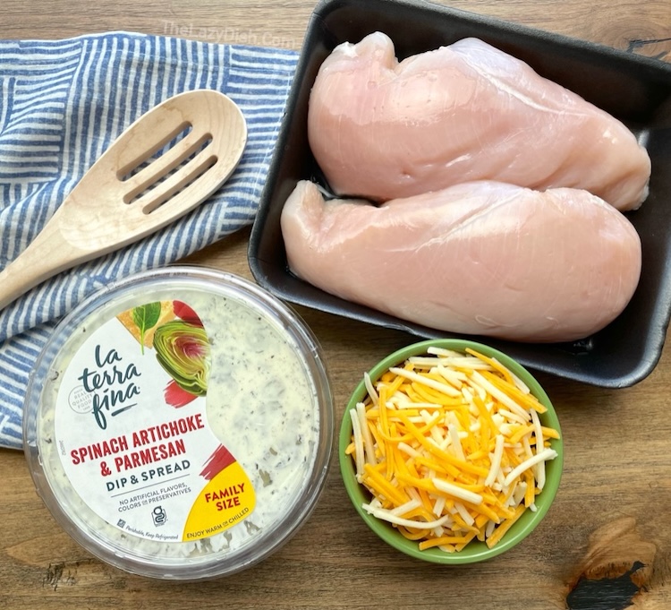 How to make a delicious baked cheesy chicken recipe with a tub of store bought spinach artichoke dip! So easy to make with just 3 ingredients. 