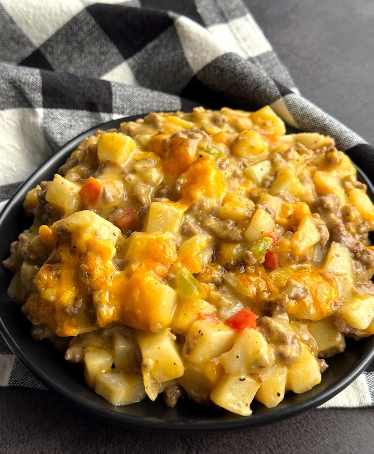 Yummy cheesy ground beef and potatoes on a plate ready to be eaten for dinner!