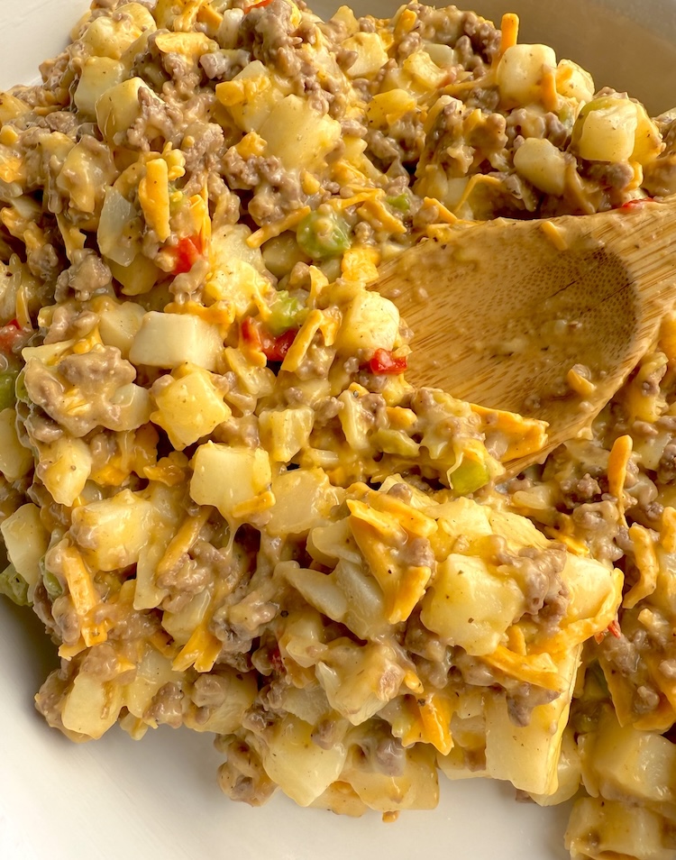 Step three of making a cheesy ground beef budget dinner casserole. 