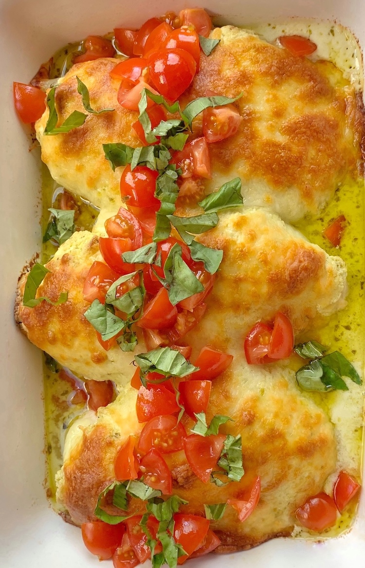 How to make chicken breasts topped with a mixture of cream cheese and basil pesto followed by lots of shredded mozzarella. 