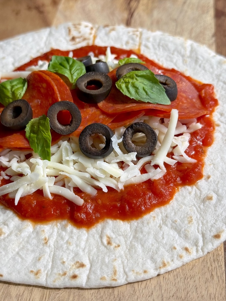 A fun and easy dinner idea for busy weeknights. How to make pizza in flour tortillas!