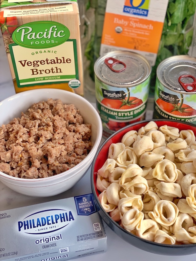 Six ingredients for making the best sausage tortellini soup in your slow cooker. Ground sausage, cheese tortellini, cream cheese, chicken broth, spinach, and canned tomatoes. 