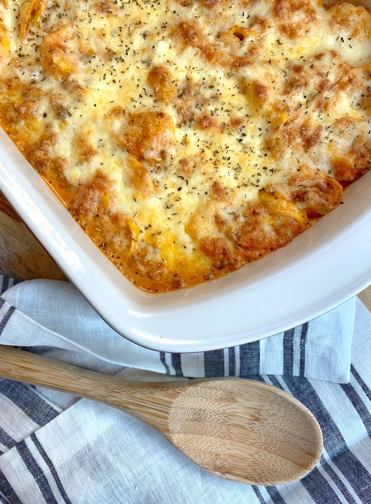 Delicious family dinner idea made with cheese tortellini, cream cheese meat sauce, and lots of gooey mozzarella. 