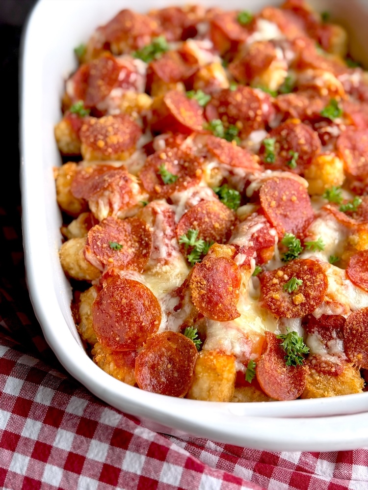 Crispy tater tots and pepperoni in a baking dish, cooked to perfection to make a yummy comfort food dinner for a large family with kids. 