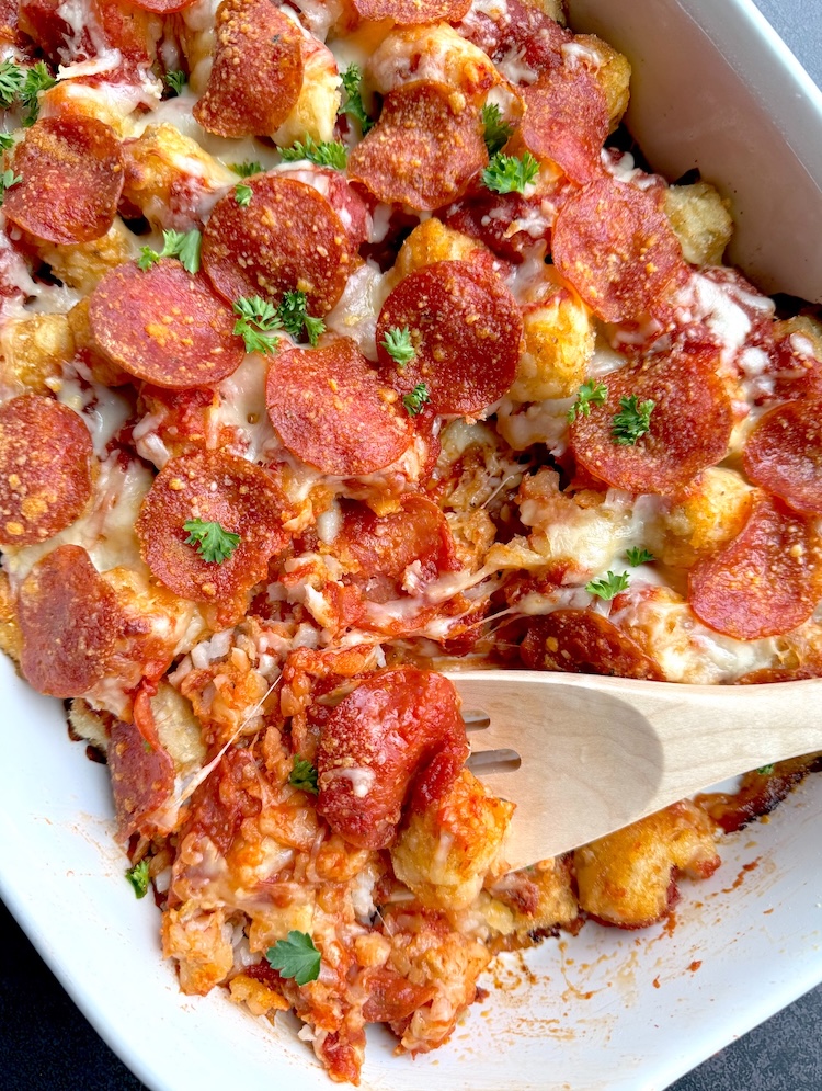 Easy no prep dump dinner made with frozen tater tots and pepperoni, to make a unique pizza in the form of a casserole. 