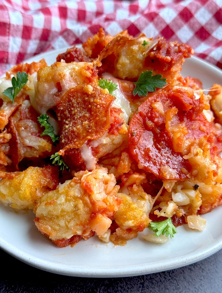 Easy and delicious dump and bake meal made with cheap ingredients including frozen tater tots and pizza. 